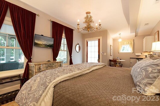 bedroom with a notable chandelier