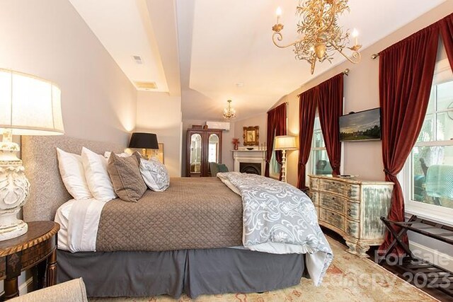 bedroom featuring a notable chandelier