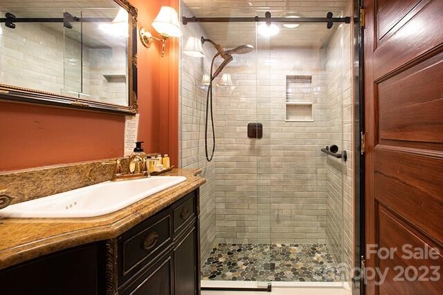 bathroom with vanity and walk in shower