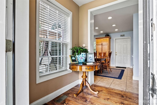 doorway with light tile patterned flooring