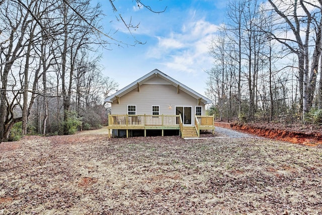 back of property featuring a deck