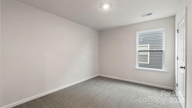 unfurnished room with light colored carpet