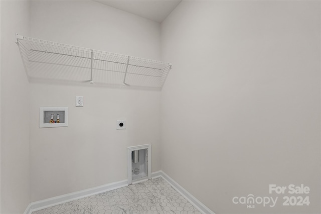 laundry area with light tile flooring, washer hookup, and electric dryer hookup