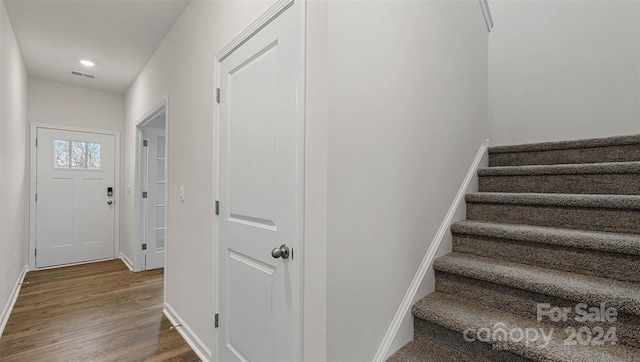 stairway with dark wood-type flooring