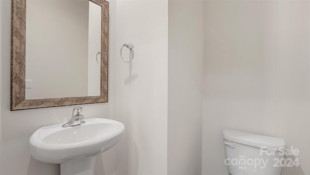 bathroom with sink and toilet