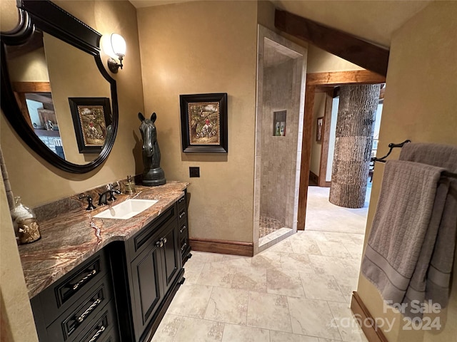 461 Spice Bottom Trl, Banner Elk, NC 28604 - full bathroom with baseboards, vanity, and tiled shower