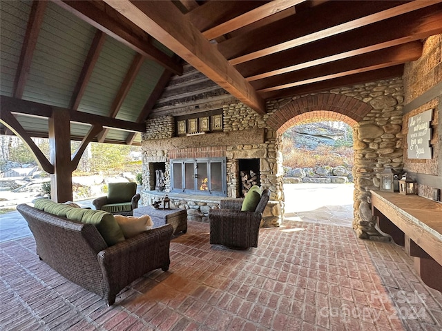 view of patio / terrace featuring an outdoor living space with a fireplace