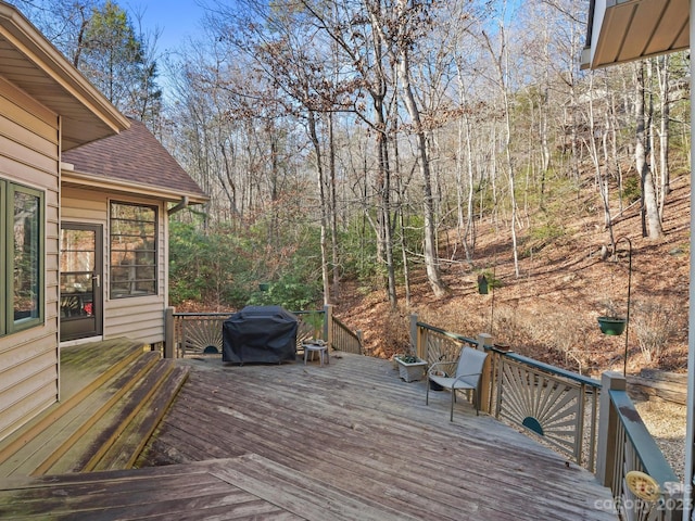 wooden terrace featuring grilling area