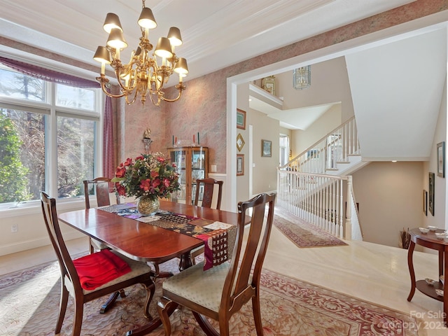 tiled dining space with an inviting chandelier and ornamental molding