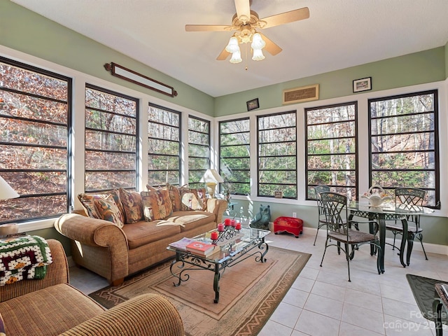 sunroom featuring a wealth of natural light and ceiling fan