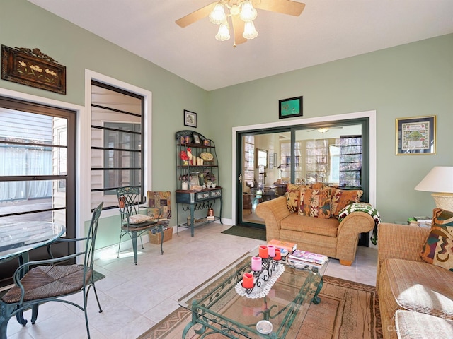 living room featuring ceiling fan and light tile patterned flooring