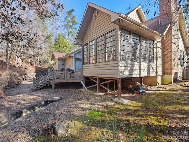 back of house featuring a deck