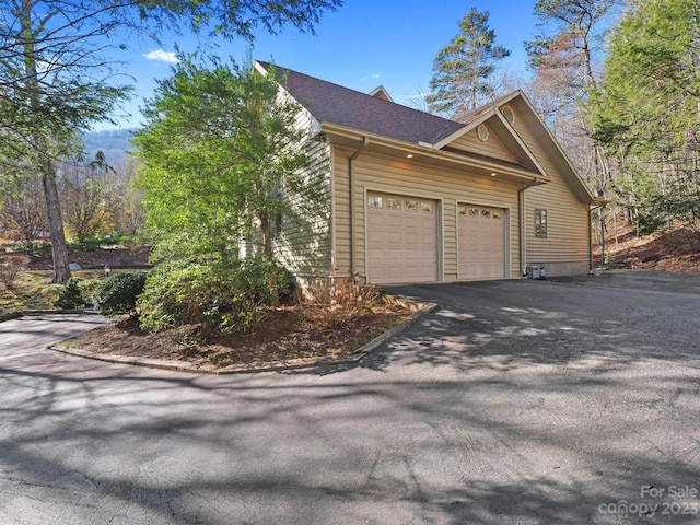 view of home's exterior with a garage