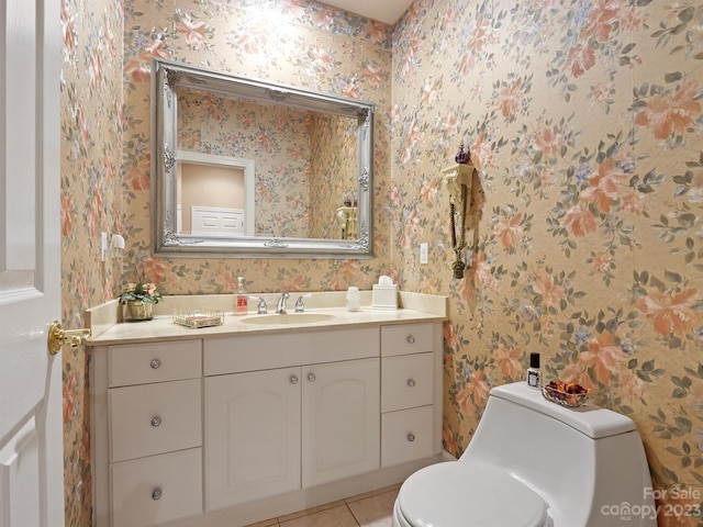 bathroom featuring tile patterned floors, toilet, and vanity