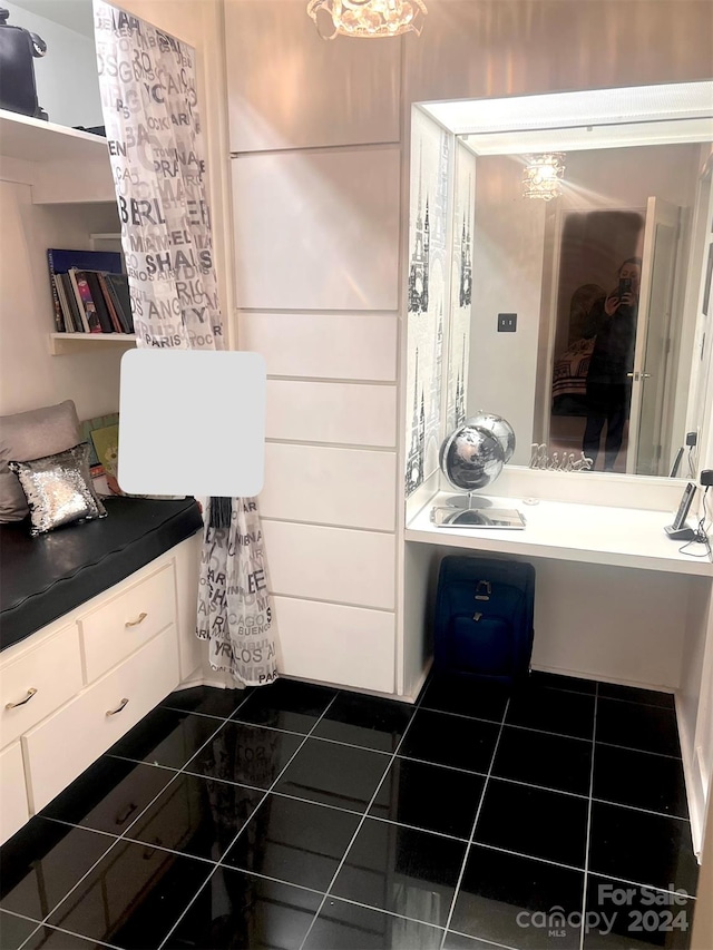 bathroom featuring vanity and tile flooring