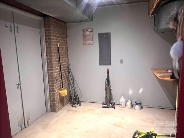 basement featuring brick wall