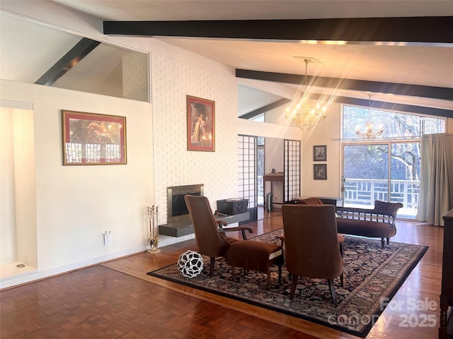 dining area featuring baseboards, lofted ceiling with beams, a brick fireplace, and a notable chandelier