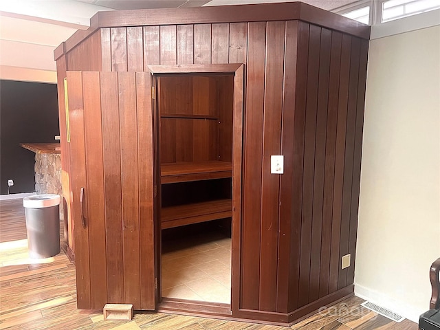 view of sauna featuring baseboards and wood finished floors