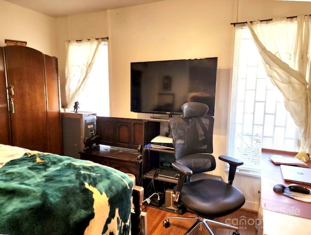 bedroom with wood finished floors