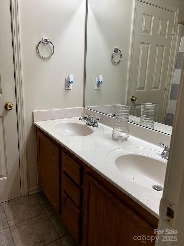 bathroom featuring tile patterned flooring and vanity