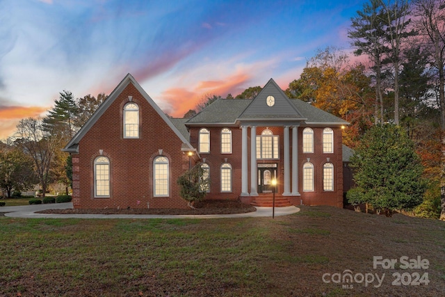 view of front of house with a yard