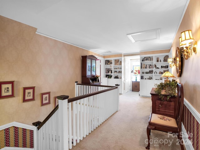 corridor featuring built in shelves and light carpet