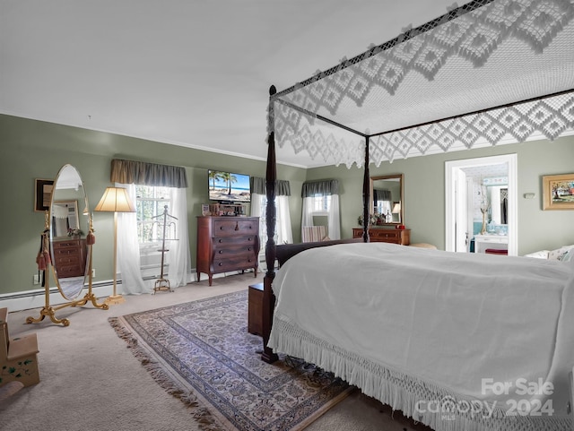 carpeted bedroom featuring ensuite bath