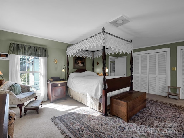 bedroom featuring ornamental molding and carpet floors