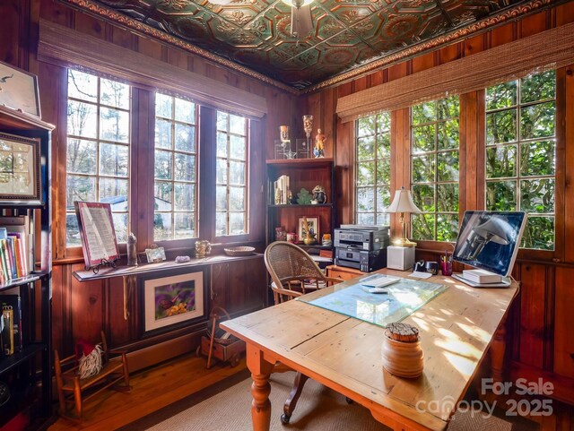 429 S Ridgecrest Ave, Rutherfordton, NC 28139 - office area with an ornate ceiling, wood walls, a healthy amount of sunlight, and wood finished floors