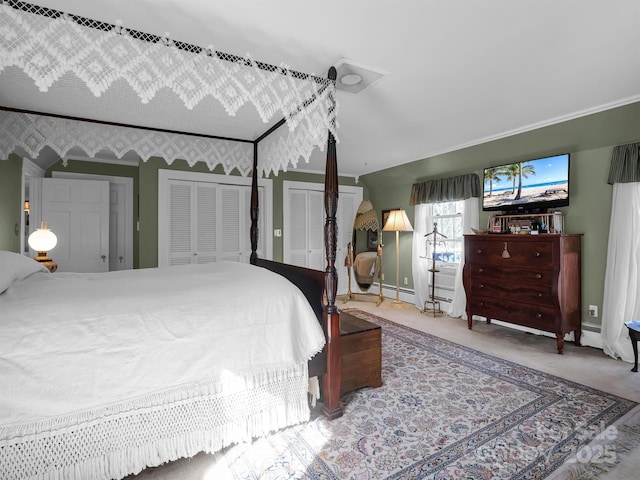 429 S Ridgecrest Ave, Rutherfordton, NC 28139 - carpeted bedroom featuring two closets, a baseboard radiator, and ornamental molding