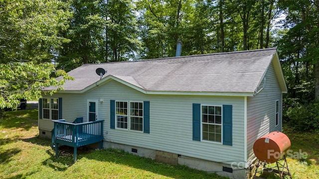 rear view of house with a yard