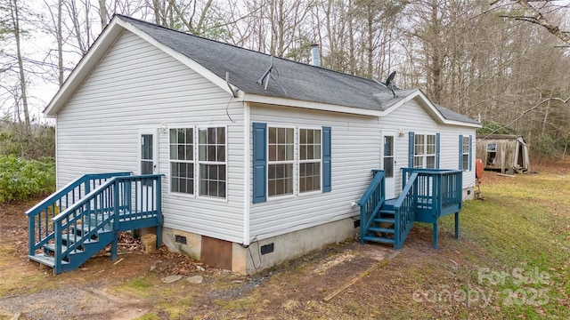 view of home's exterior with a yard