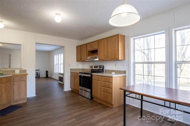 kitchen featuring stainless steel electric range oven, hanging light fixtures, and a textured ceiling