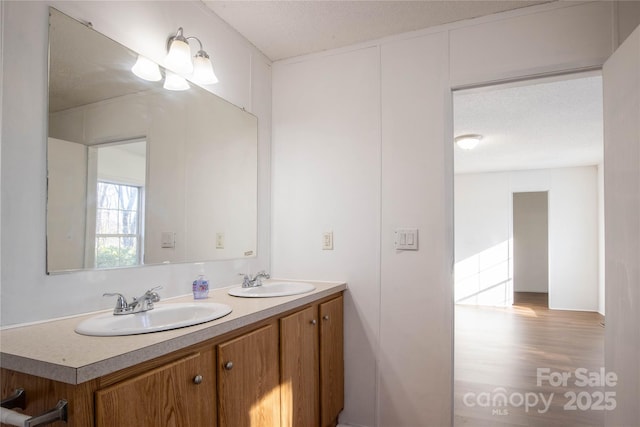 bathroom featuring vanity and a textured ceiling