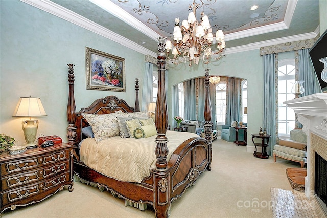 carpeted bedroom featuring crown molding, a chandelier, and a tray ceiling