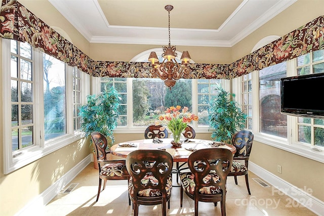 dining area with crown molding, light tile flooring, a chandelier, and a wealth of natural light