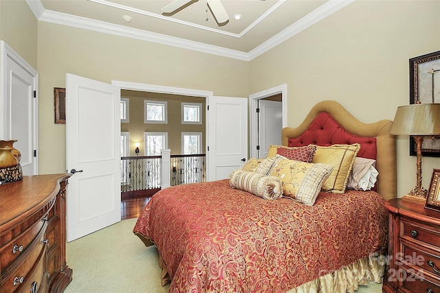 bedroom with light carpet, ceiling fan, and crown molding