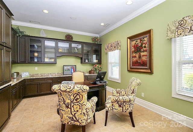 home office featuring built in desk, ornamental molding, a wealth of natural light, and light tile floors