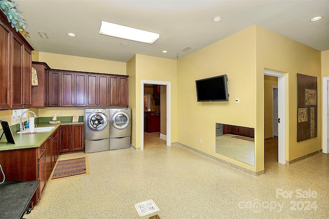 kitchen with washing machine and clothes dryer and sink