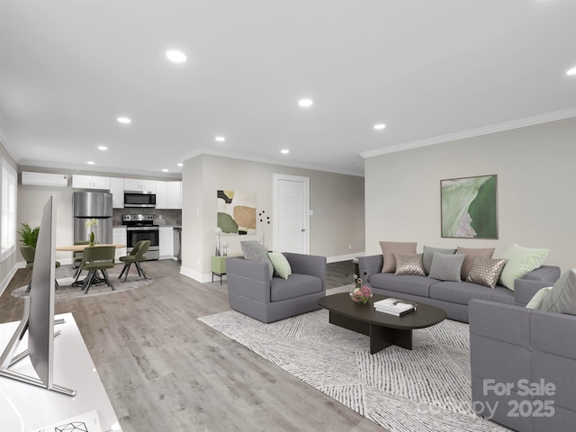 living room featuring light hardwood / wood-style floors, an AC wall unit, and crown molding