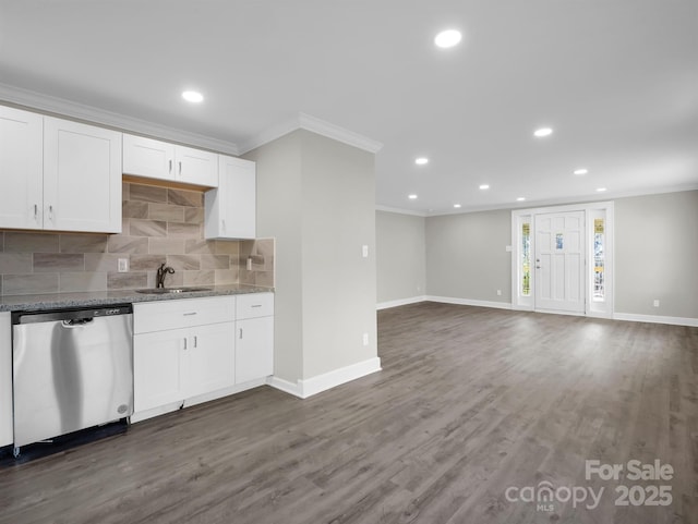 kitchen featuring white cabinetry, dark hardwood / wood-style flooring, sink, backsplash, and stainless steel dishwasher