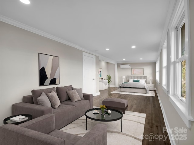 living room featuring an AC wall unit, ornamental molding, and hardwood / wood-style flooring