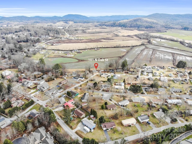 birds eye view of property with a mountain view