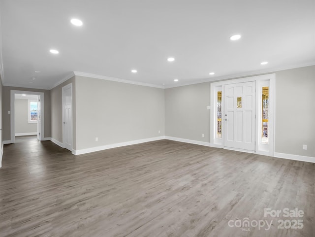 interior space with dark wood-type flooring and ornamental molding