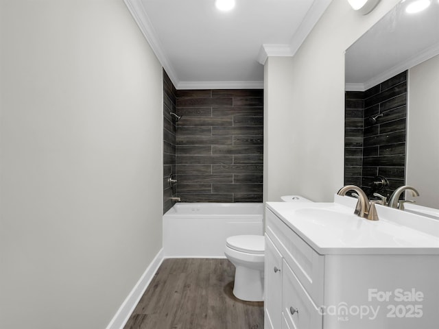 full bathroom featuring toilet, tiled shower / bath combo, wood-type flooring, ornamental molding, and vanity