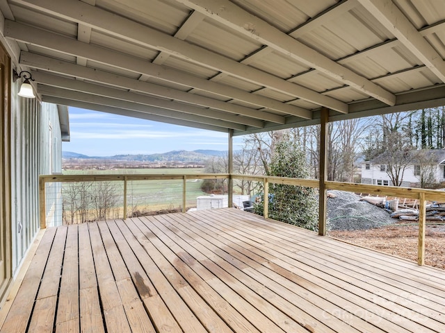 wooden deck with a mountain view