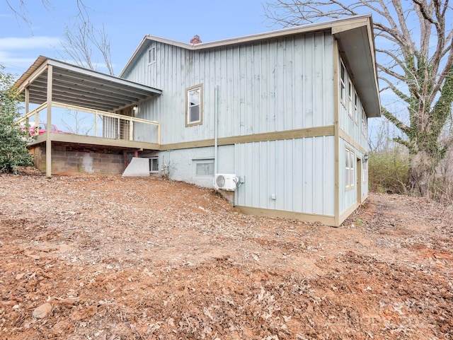 view of side of property featuring ac unit