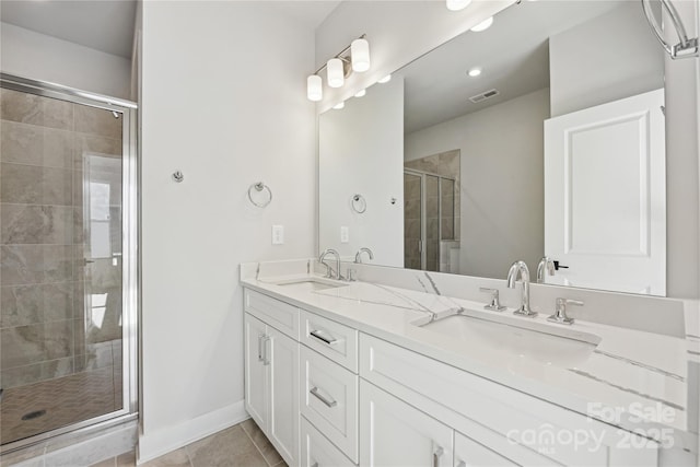 1428 Hamilton St Unit 13, Charlotte, NC 28206 - bathroom with double vanity, visible vents, a stall shower, and a sink