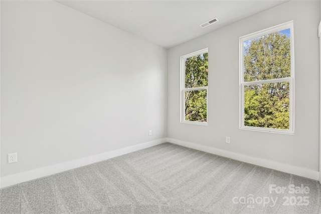 1428 Hamilton St Unit 13, Charlotte, NC 28206 - spare room featuring visible vents, carpet, and baseboards