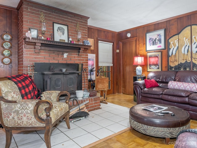 living room featuring wood walls, a brick fireplace, and light parquet floors